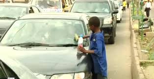 A child in traffic hustling 