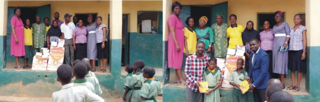 Receiving the learning materials, The Head Teacher, OLG Primary school